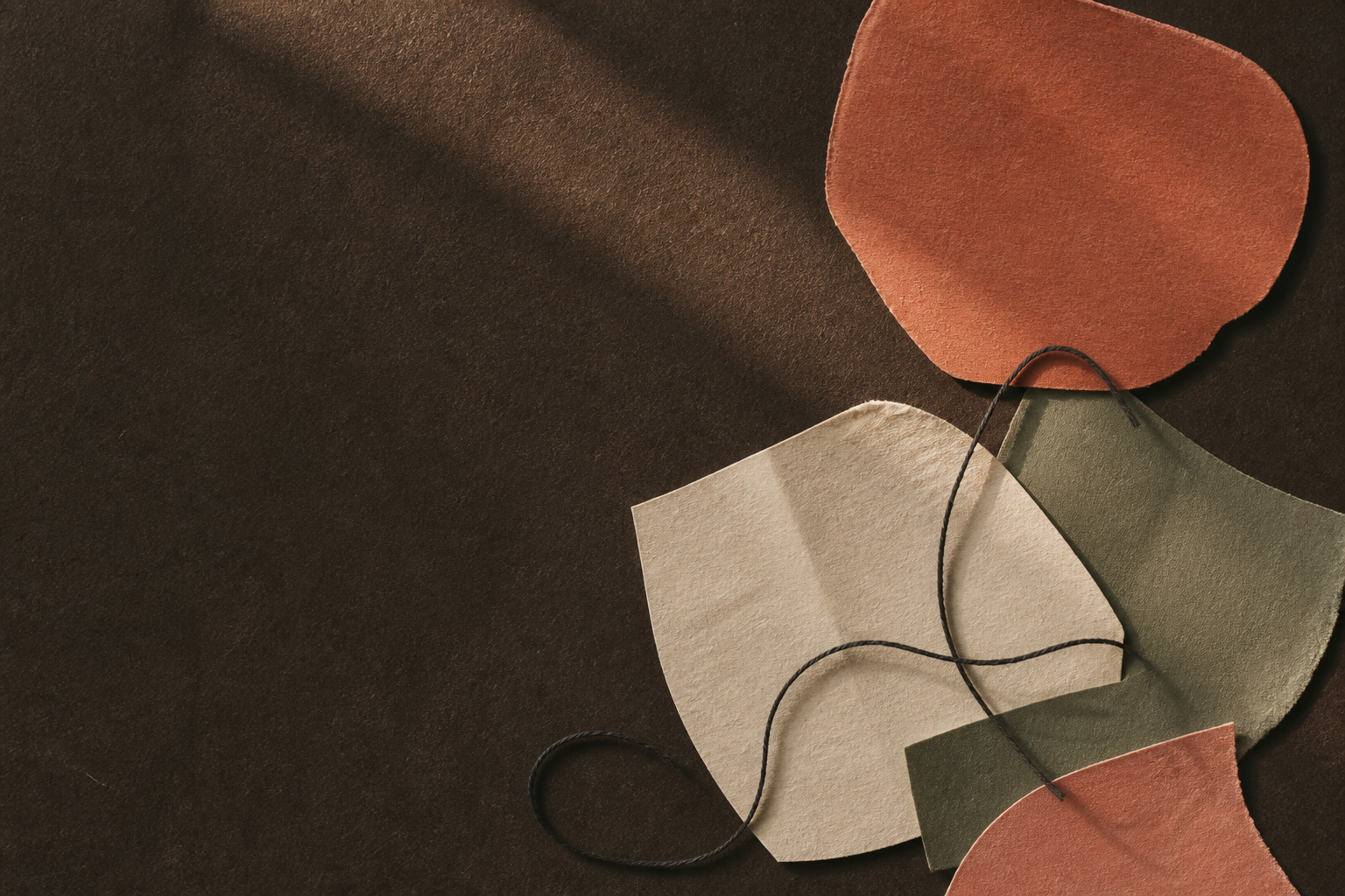 Abstract warm paper collage stitched together with thread